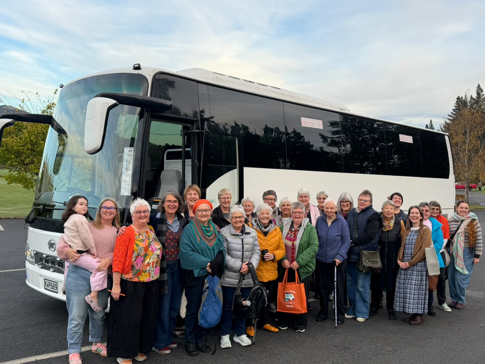 Guests gathered beside a Uniquely Dunedin coach